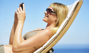 woman with mobile in deckchair