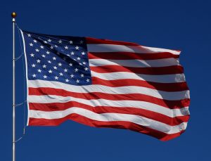 American Flag In Blue Sky