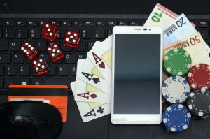 Poker And Dice With iPhone On Keyboard